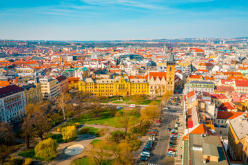 Obraz premium Aerial View of Prague City at Sunset Time, Roofs, Streets and Buildings