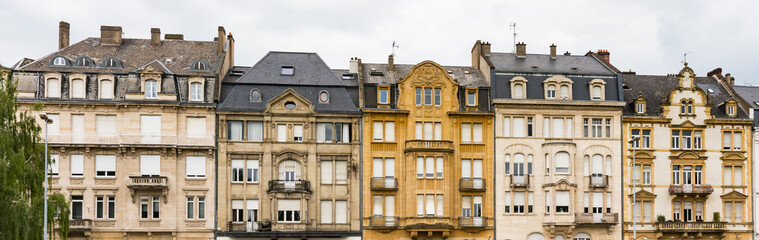 yellow building with apartments in Thionville, France - Powered by Adobe