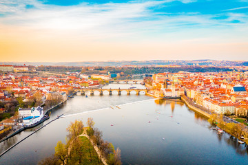 Aerial Panoramic View of Prague City above the River, Bridges and Old Town at Sunset Time