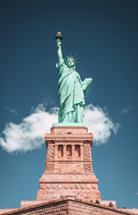 Fototapeta na wymiar Geometric Front View of the Statue of Liberty with cloud on blue sky background