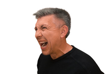 Guy does not look into camera and shouts. Isolated half turn portrait on white background. Emotion and gesture of middle aged unshaven shaggy man in black t-shirt. Angry face and aggressive view