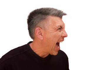 Obraz premium Guy does not look into camera and shouts. Isolated profile portrait on white background. Emotion and gesture of middle aged unshaven shaggy man in black t-shirt. Angry face and aggressive view
