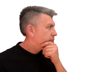 Obraz premium Guy touches chin with hand. Isolated profile portrait on white background. Emotion and gesture of middle aged unshaven shaggy man in black t-short. Thoughtful face and wistful view