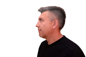 Fototapeta premium Guy looks upward. Isolated profile portrait on white background. Emotion and gesture of middle aged unshaven shaggy man in black t-shirt. Settled face and condescending view