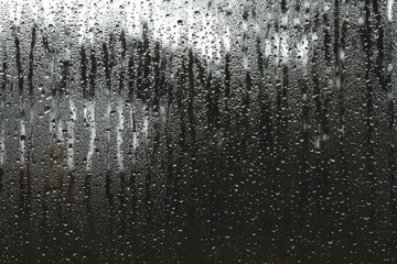 Naklejka na ściany i meble Raindrops on a window glass