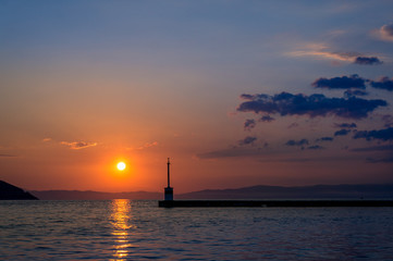 Naklejka na ściany i meble Sunset in the sea port