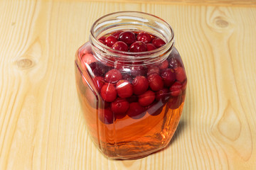 Cranberry beverage in a glass jar. Soft drinks for children.