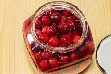 Cranberry beverage in a glass jar. Soft drinks for children.