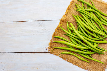 Phaseolus vulgaris, green common bean or kidney bean on rustic sackcloth