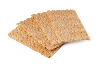 Four crispy whole grain cereal crispbreads. Cutout, isolated