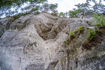 Fototapeta na wymiar Sandstone cliffs of Sietiniezis on the shore of the river Gauja in Latvia