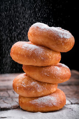 tasty juicy donuts sprinkled with powdered sugar