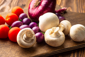 Vegetables on vintage wood background - autumn harvest, soup ingredients.