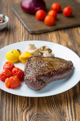 Grilled steak with vegetables
