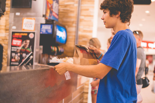 Young Man Received His Food Package Order In Fastfood Restaurant