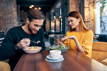 young couple having dinner in restaurant