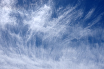 Fototapeta premium Dramatic cirrus clouds formation in the blue sky