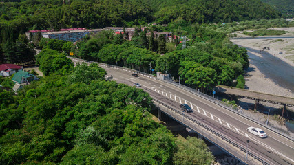 Aerial view of traffic on bridge, 2 lane road with cars