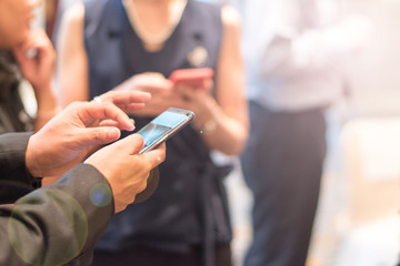 Business people hands using smartphone with social media to share information , contact  or photo.