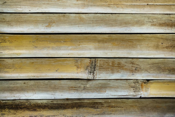 Fototapeta premium Old Brown bamboo fence background. Bamboo texture