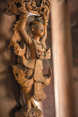 Lovely statue in the interior of a wooden temple in Bagan, Myanmar