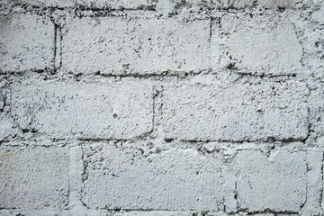 Abstract weathered textured white brick wall background