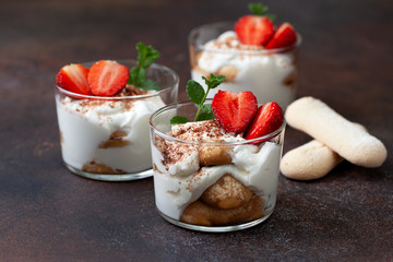 tiramisu in a glass with fresh strawberries