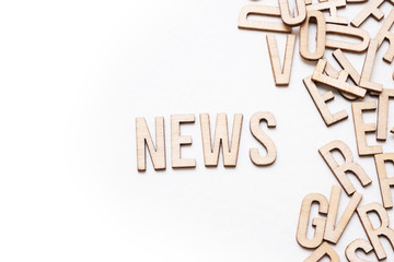 News concept, word spelled out in wooden letters