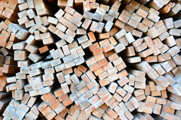 A large stack of wood boards in a lumber yard - obrazy, fototapety, plakaty