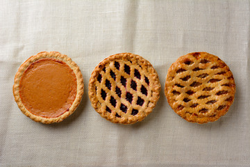 Overhead still life of fresh baked holiday pies