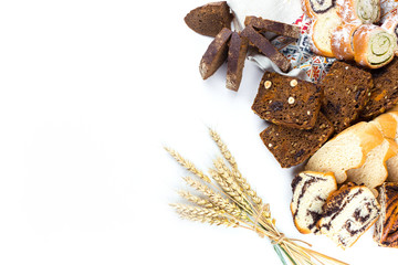 Various kinds of fresh bread, cake, homemade pastry on white isolated background. Food, vegetarian healthy food concept