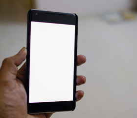 Man hand holding the black smartphone with blank screen and modern small frame design - isolated focus 