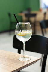 Summer drink cocktail in a bar on the wooden table. Beverage close up