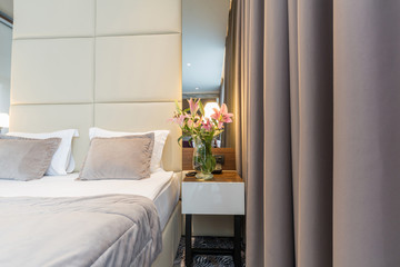 Interior of a luxury hotel double bed bedroom