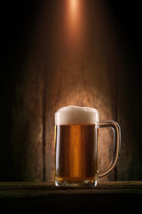 Glass beer on wood background
