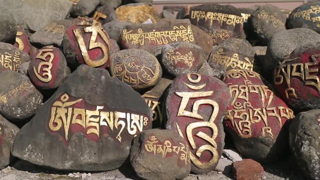 Pray stones in front of Buddhism monastery in Indian Tibet colony 
