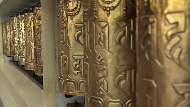 Buddhism Tibet pray wheels in Dalay Lama temple in Indian Dharamsala