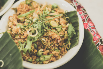 Nasi Ulam Istimewa A spectacular dish of rice with raw herbs, vegetables, minced fish and salted fish