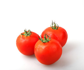 Close-Up Of Red Tomatoes On White Background