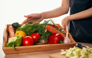 woman cutting vegetables in kitchen