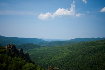 view of the Ural mountains in sunny weather from the mountain