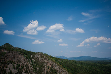 view of the Ural mountains in sunny weather from the mountain