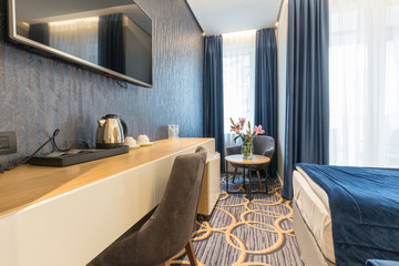 Interior of a modern luxury hotel double bed bedroom