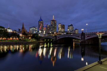 Beautiful view of the city center of Melbourne, Australia, and of the evening Yarra river illuminated by the blue hour light