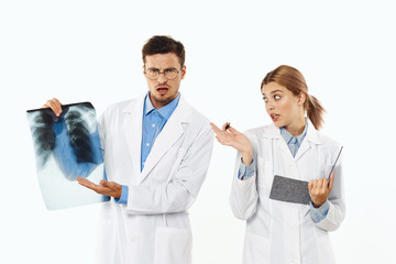 doctors looking at an xray