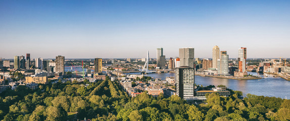 Fototapeta na wymiar Rotterdam Netherlands cityscape and Erasmus bridge. Panoramic view from Euromast tower, sunny day