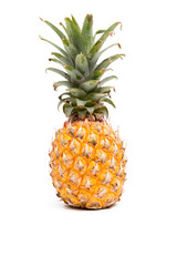 Ripe yellow pineapple isolated on white background.