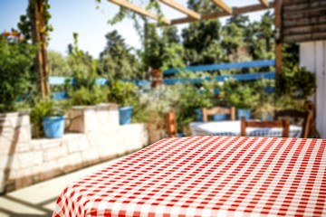 Table background and wooden board with blurred garden view