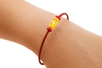 People wearing red string bracelet with golden Dragon Pixiu or Pi Yao on white background....
