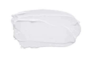 White smear and texture made with face clay or cream isolated on white background.